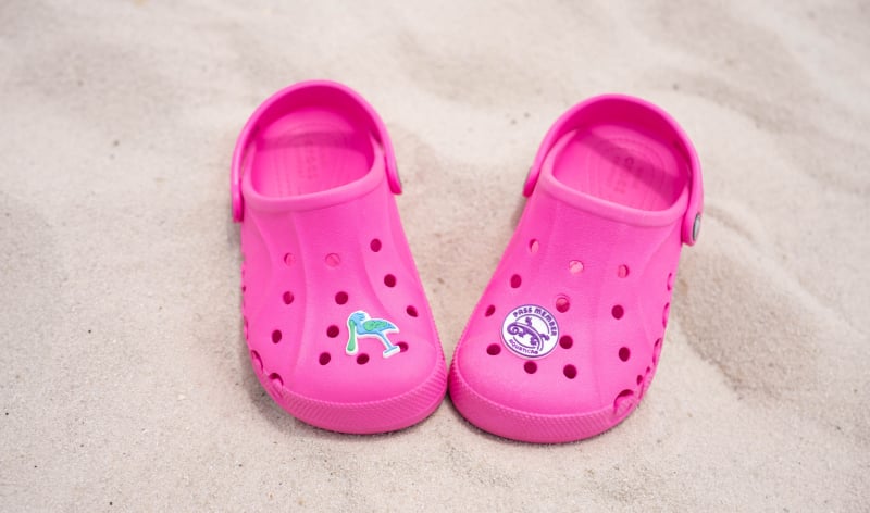 A pair of Crocs with Aquatica Orlando Croc charms