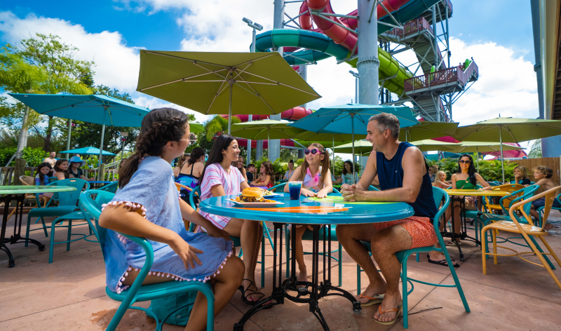 Family sitting at a table at Aquatica 