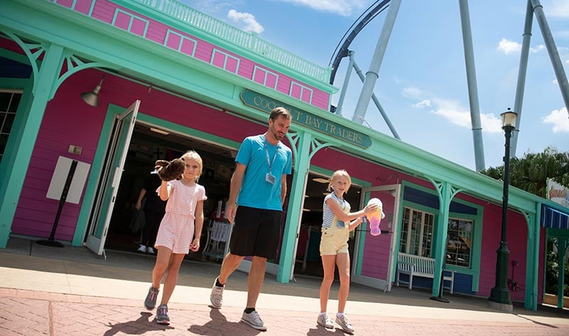 Guests walking out of a store at SeaWorld Orlando