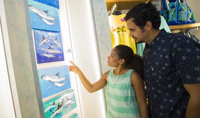 Guests looking at Guy Harvey Store merchandise