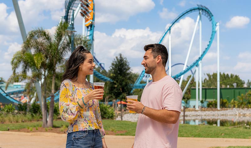 Guests standing in front of Pipeline roller coaster at SeaWorld