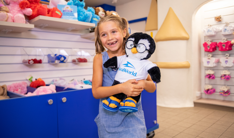 Girl with penguin plush