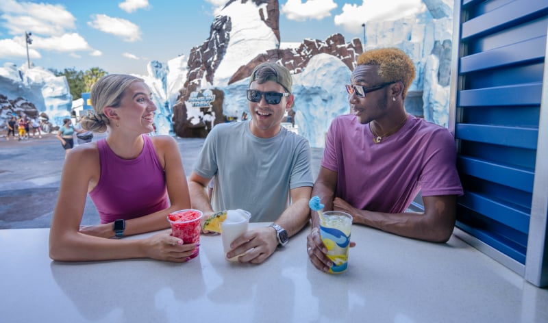 Family sitting on a bench with frozen treats