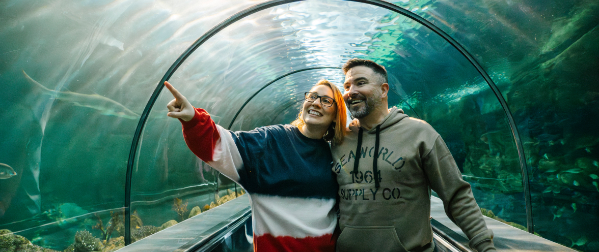 Man and woman in aquarium tunnel