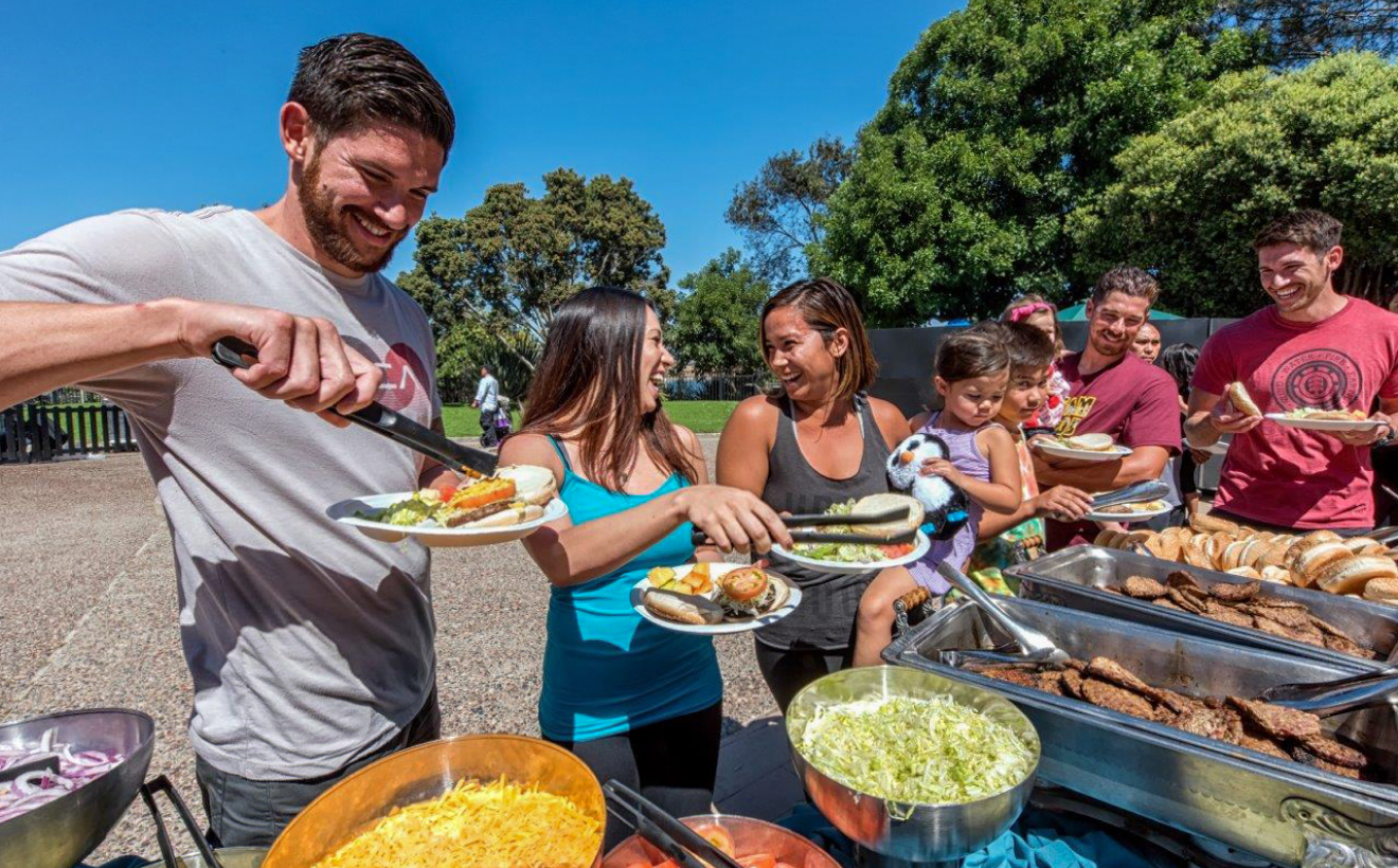 People at a picnic buffet outside