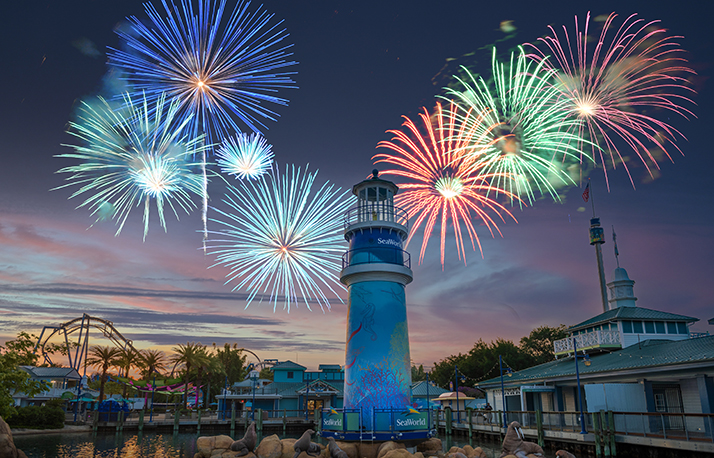 SeaWorld Orlando lighthouse with fireworks above