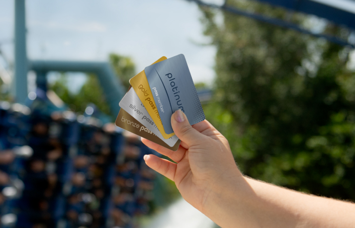 A hand holding SeaWorld Orlando Annual Passes