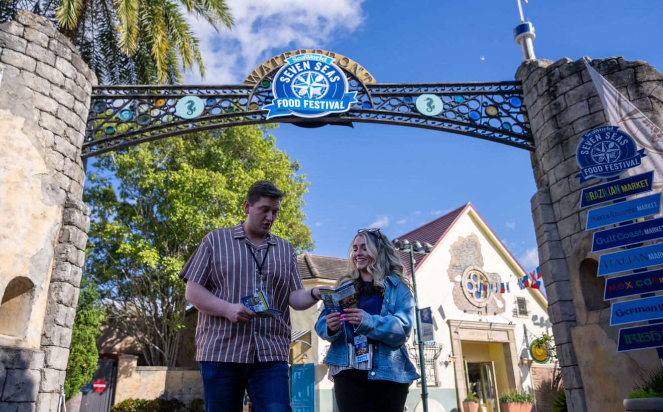 Two people looking at brochures