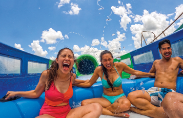 Aquatica Pass Members Enjoying a slide together.