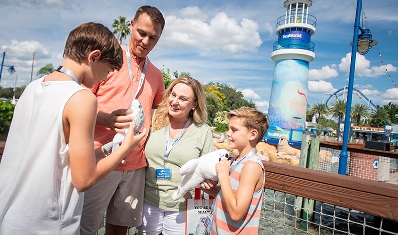 Family near SeaWorld Orlando lighthouse entrance