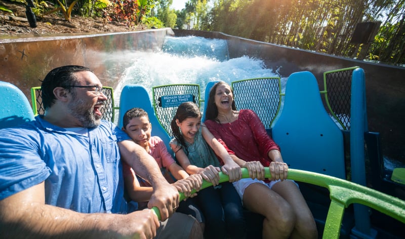 Family riding a water ride at SeaWorld Orlando.