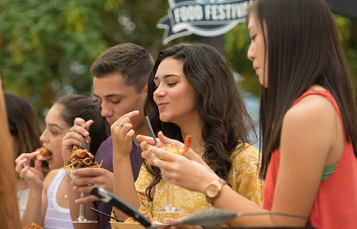Teens enjoying SeaWorld's Seven Seas Food Festival