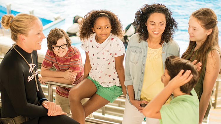 Children talking with an Animal Care Specialist
