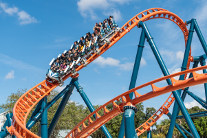 People riding the Ice Breaker roller coaster at SeaWorld Orlando