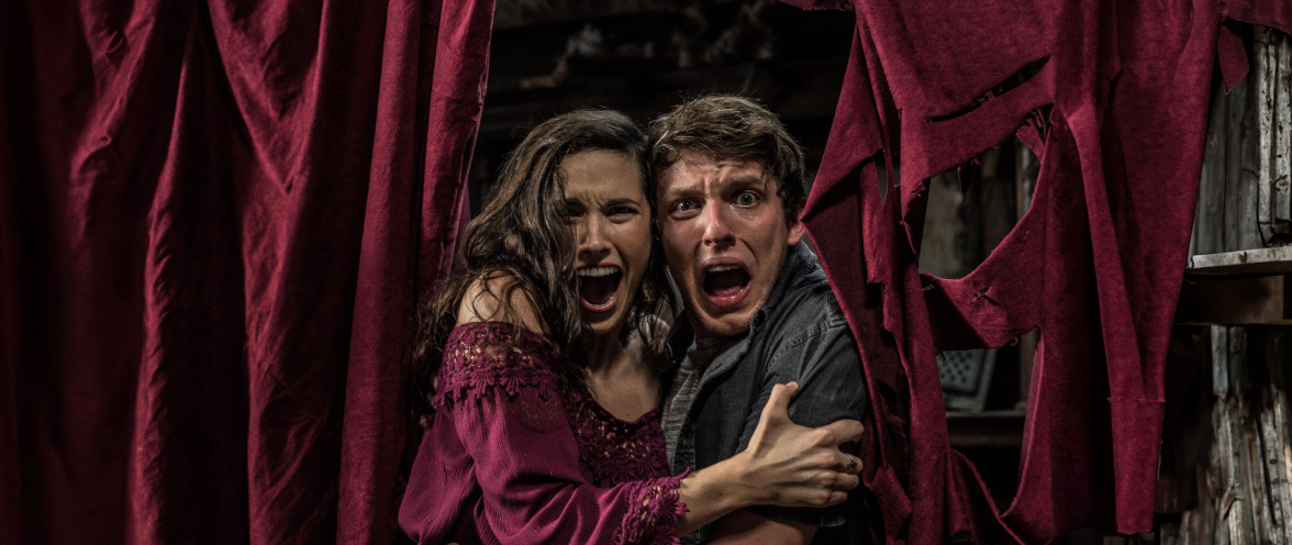 Two people getting scared at Howl-O-Scream at SeaWorld San Antonio.