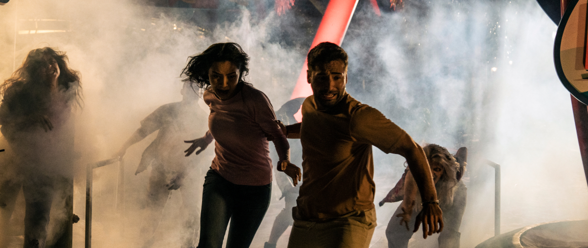 Two people getting scared at Howl-O-Scream at SeaWorld San Antonio.