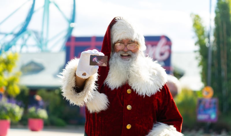 Santa holding a SeaWorld San Diego ticket