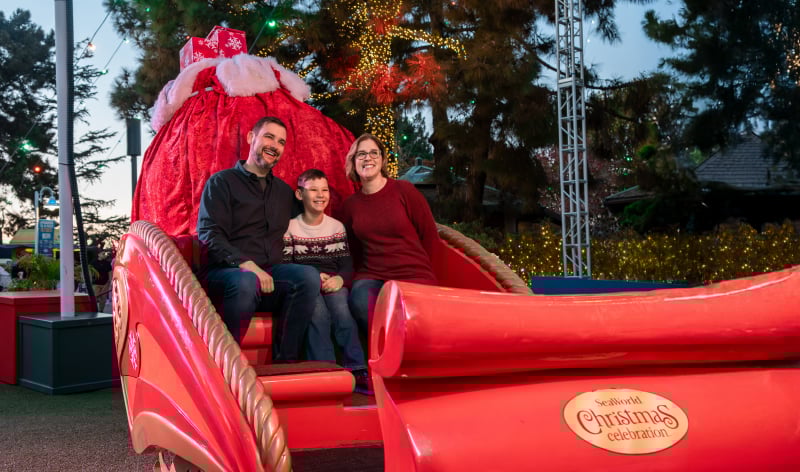 A family in a red sleigh
