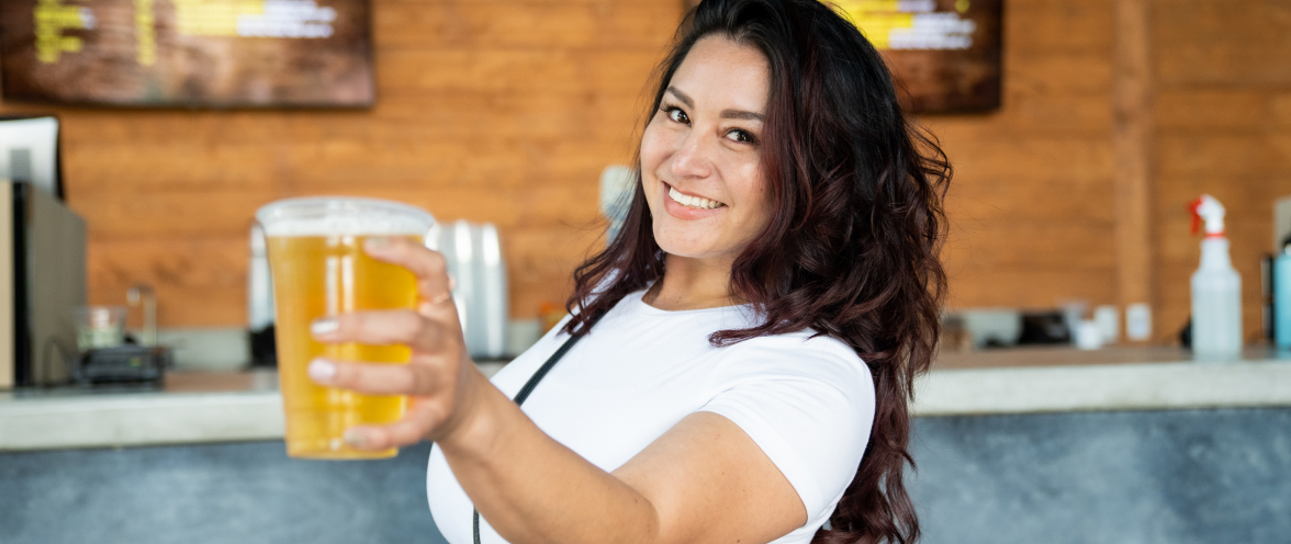 Woman holding a beer