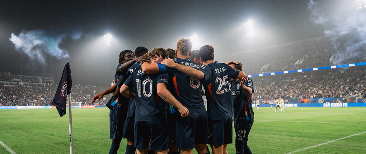 Soccer players huddling