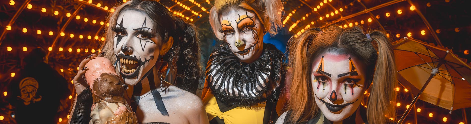 Three Howl-O-Scream clowns