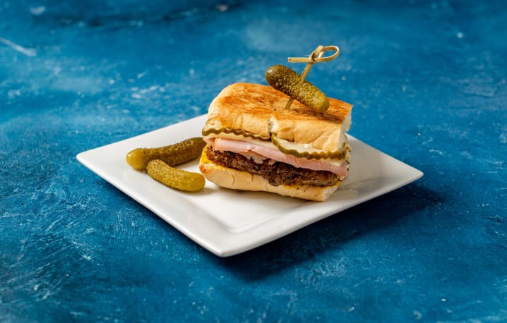 Cuban sandwich with a side of pickles