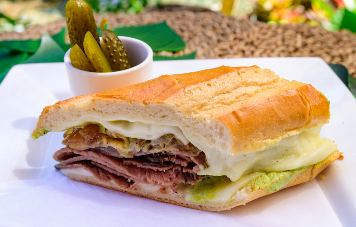 Cuban sandwich with a side of pickles