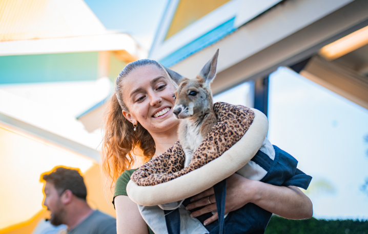 Animal specialist with a baby kangaroo