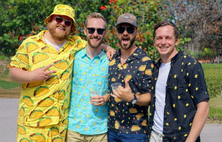Four men wearing taco print shirts