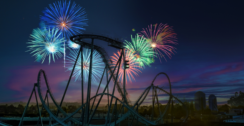 Fireworks behind a roller coaster