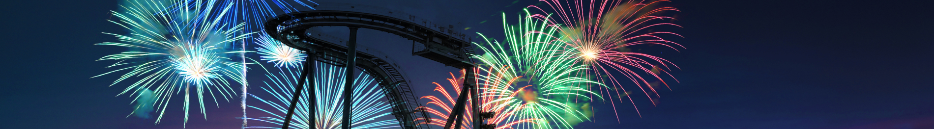 Fireworks behind a roller coaster