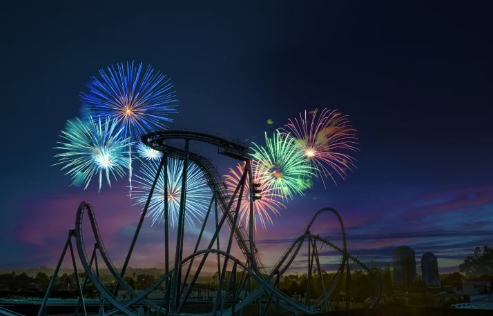 Fireworks behind a roller coaster