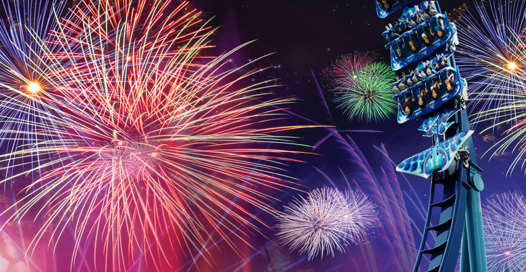 Fireworks behind a roller coaster