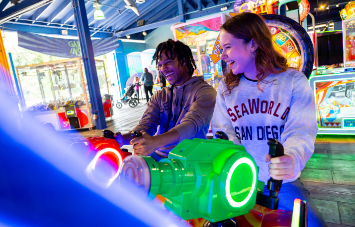 Two people playing at an arcade