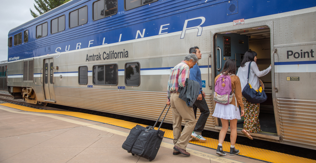 A family entering an Amtrak train