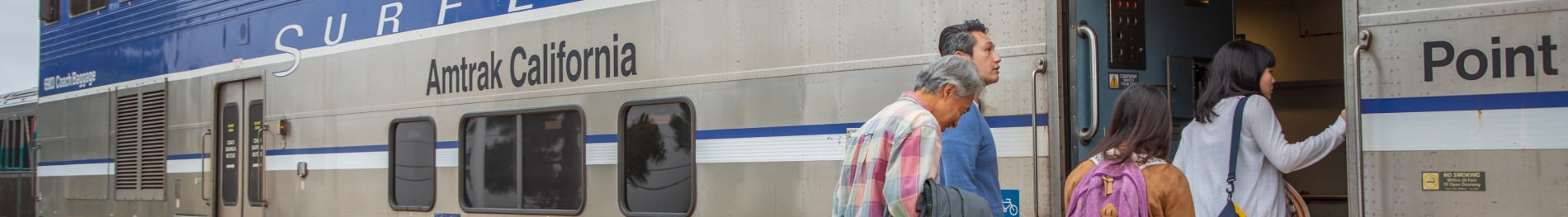 A family entering an Amtrak train
