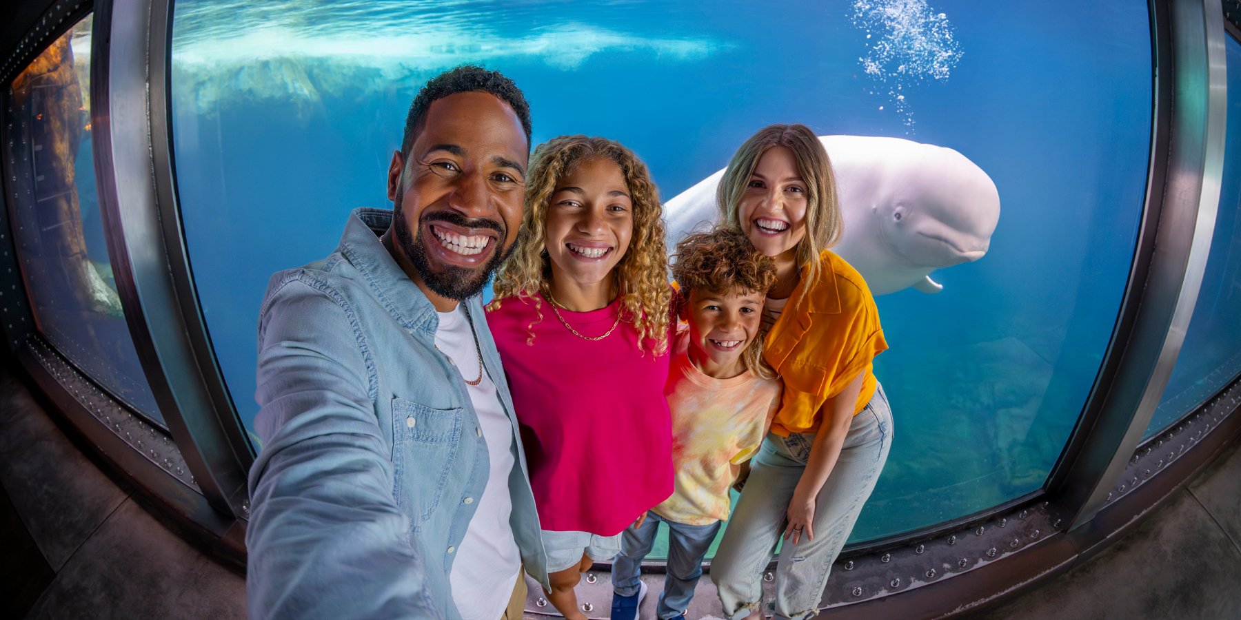 Family in front of a Beluga Whale